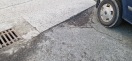 Foto: Schlaglocher im Übergang zum Parkplatz 