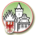 Abbildung Logo roter Kreis mit Haussilhouetten 