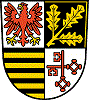 Abbildung Wappen Potsdam-Mittelmark in den Farben schwarz, gelb, rot und weiß
